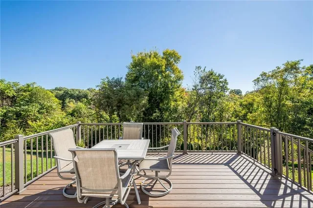 a view of a table and chairs on the roof deck