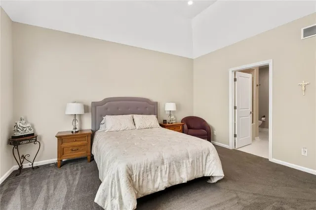 a bedroom with a bed and a closet