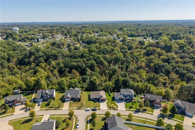 an aerial view of a city with lots of residential buildings