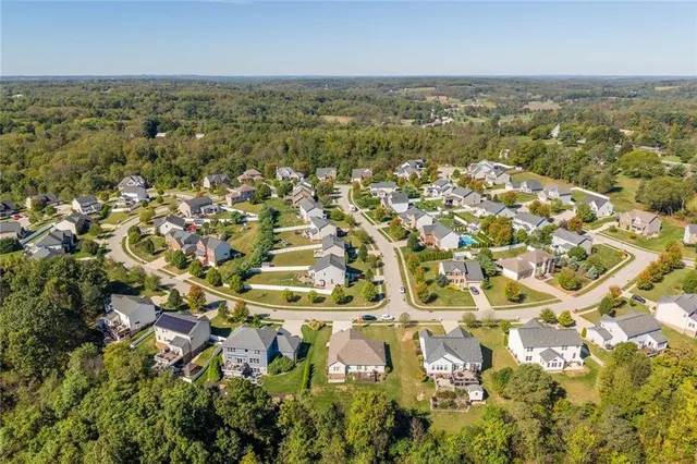 an aerial view of residential building with parking space