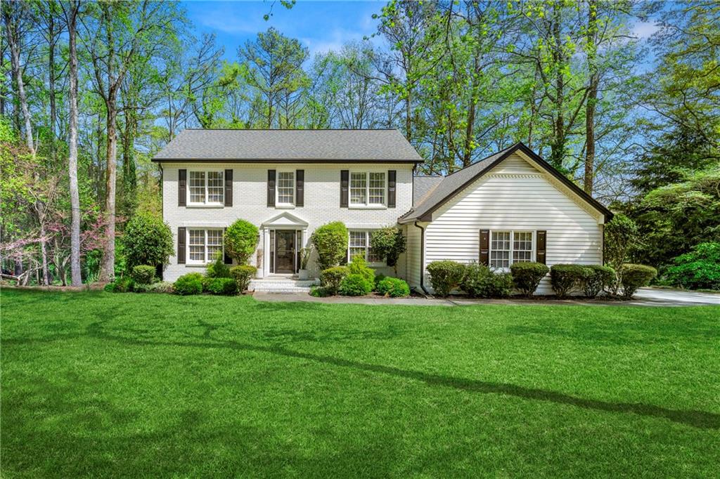 292 Old Rosser Road Stone Mountain, GA 30087 - Photo 1 of 66 a front view of a house with a yard