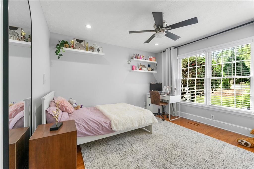 292 Old Rosser Road Stone Mountain, GA 30087 - Photo 29 of 66 a bedroom with a bed and a window