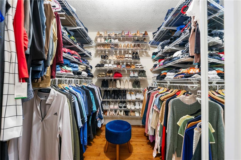 292 Old Rosser Road Stone Mountain, GA 30087 - Photo 35 of 66 a view of walk in closet with clothes and shoes