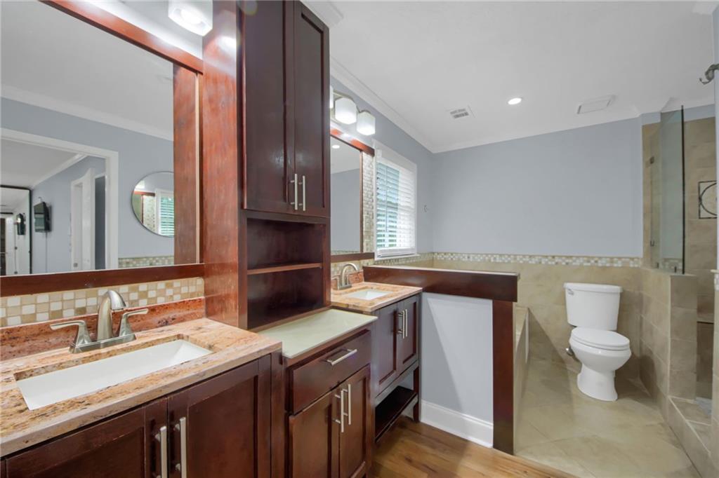 292 Old Rosser Road Stone Mountain, GA 30087 - Photo 37 of 66 a bathroom with a granite countertop sink and a mirror