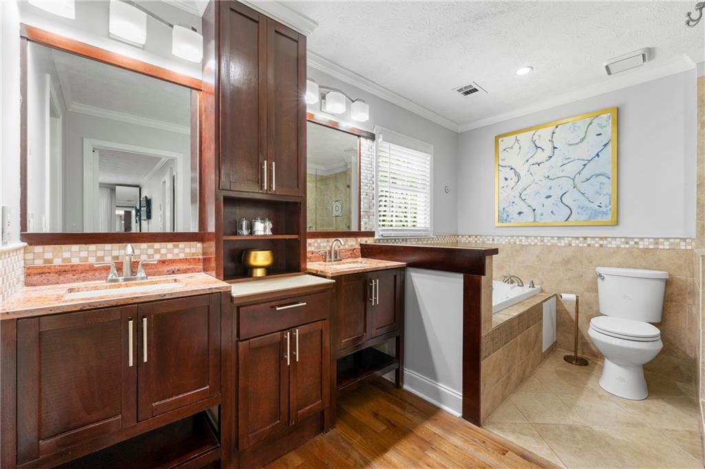 292 Old Rosser Road Stone Mountain, GA 30087 - Photo 38 of 66 a bathroom with a toilet sink and mirror