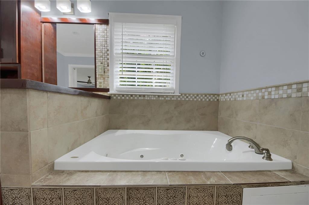 292 Old Rosser Road Stone Mountain, GA 30087 - Photo 39 of 66 a bathroom with a bathtub