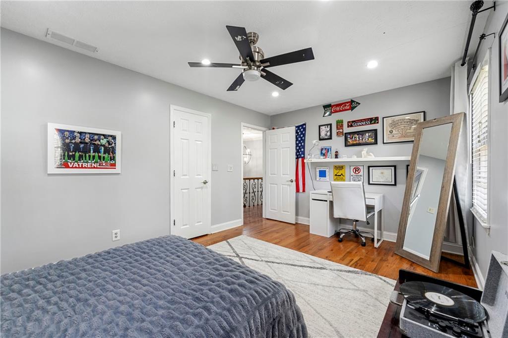 292 Old Rosser Road Stone Mountain, GA 30087 - Photo 41 of 66 a bedroom with a bed and a bookshelf