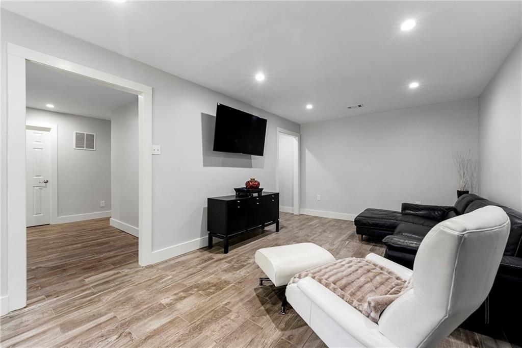 292 Old Rosser Road Stone Mountain, GA 30087 - Photo 51 of 66 a living room with furniture and a flat screen tv
