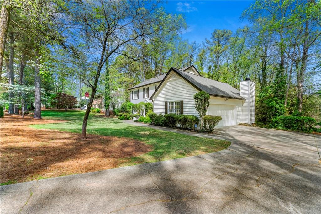 292 Old Rosser Road Stone Mountain, GA 30087 - Photo 57 of 66 a front view of a house with yard and green space