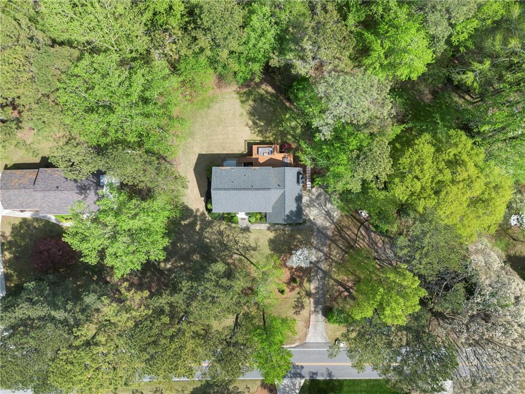292 Old Rosser Road Stone Mountain, GA 30087 - Photo 64 of 66 an aerial view of a house with a yard and tree s