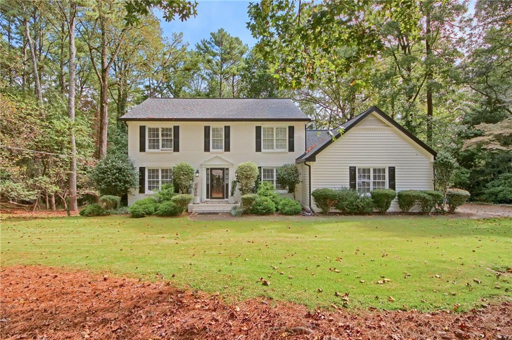 292 Old Rosser Road Stone Mountain, GA 30087 - Photo 66 of 66 a front view of a house with yard and green space