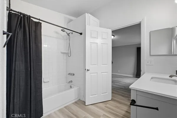 a bathroom with a toilet a sink a mirror a vanity and window