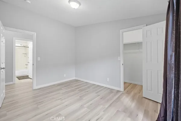 wooden floor and window in an empty room