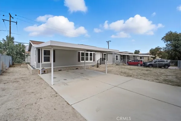 a view of house with car parked