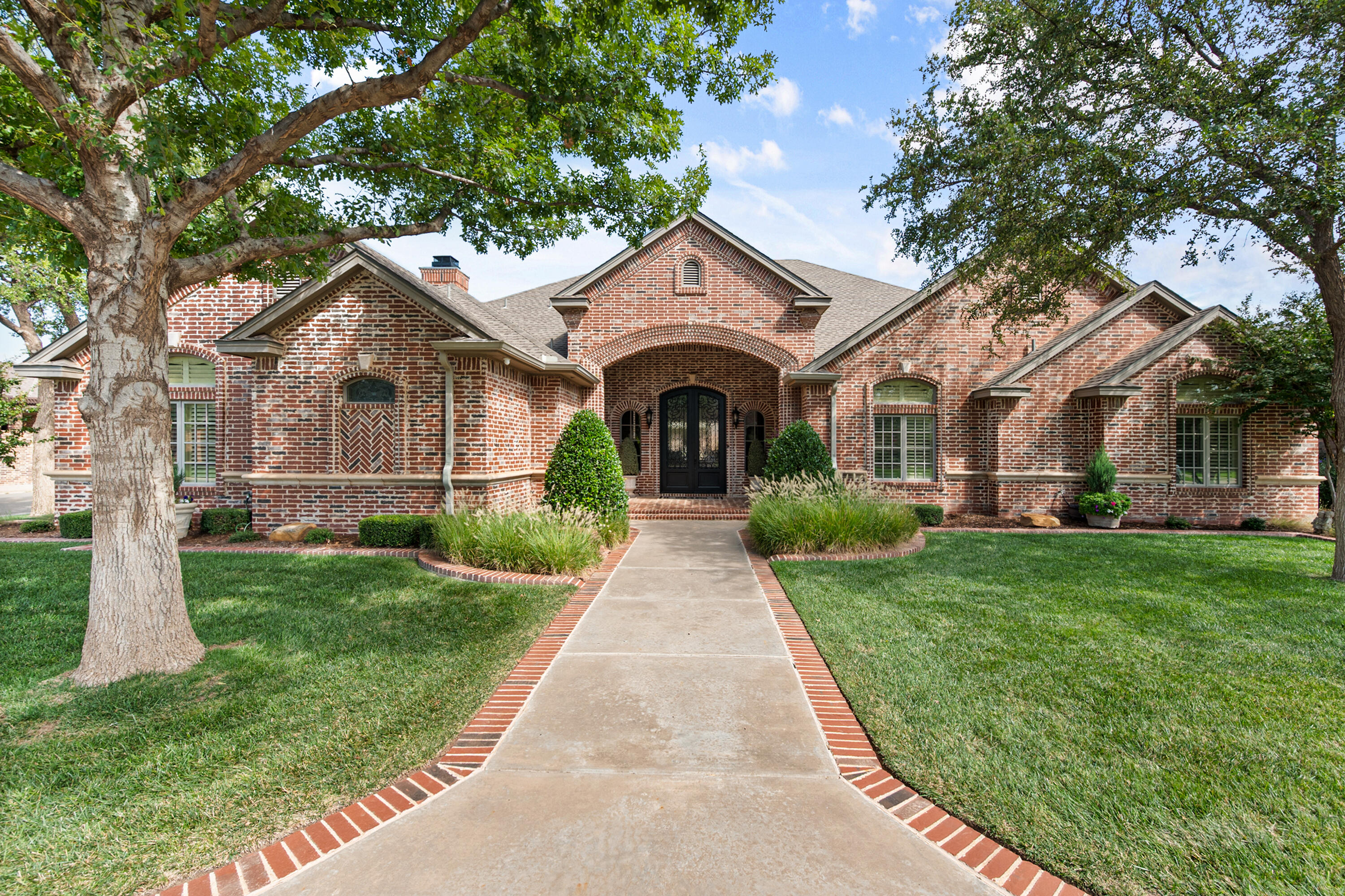 4610 102nd Street Lubbock, TX 79424 - Photo 1 of 1 a front view of a house with yard and green space