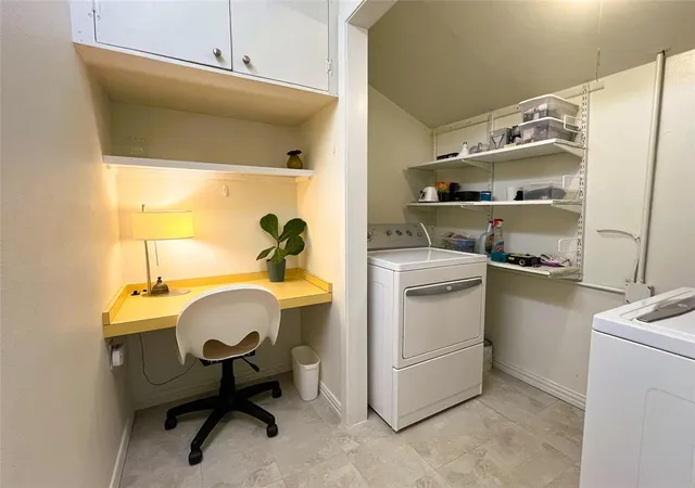 a view of a backyard with a garden and fire pit