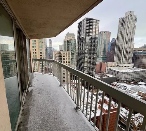 a view of a balcony with wooden floor