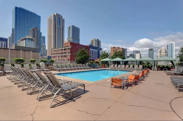 a view of a city with lawn chairs