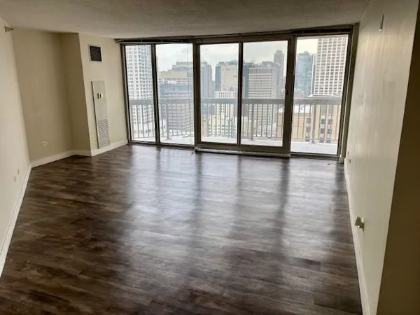 a view of empty room with floor to ceiling window