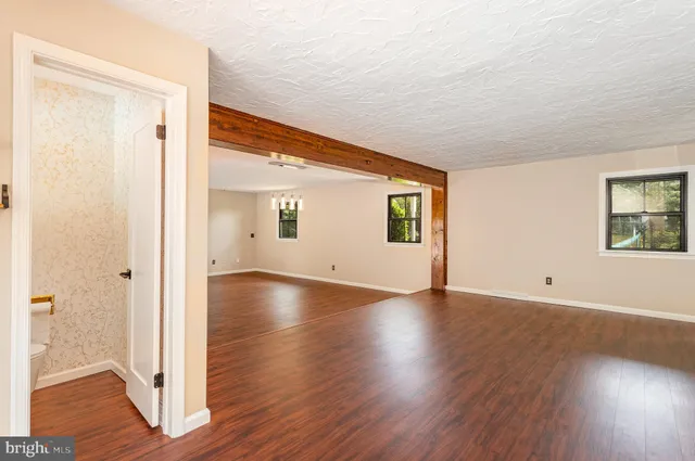 a view of an entryway with wooden floor