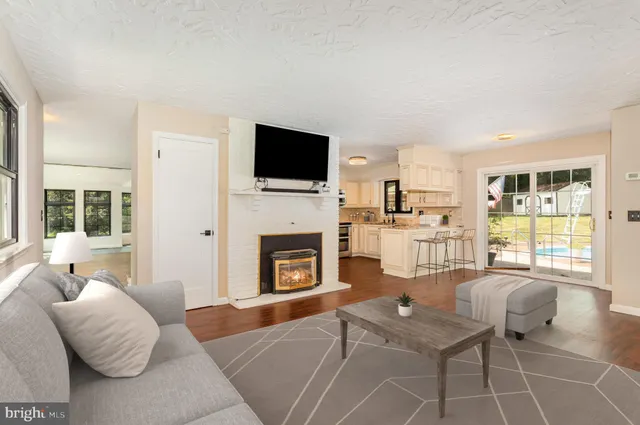 a view of an entryway with wooden floor