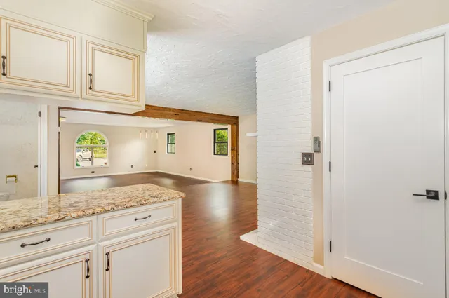 a view of a bath tub sitting in a bathroom next to a window