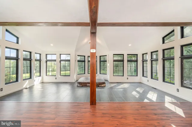 a bathroom with a granite countertop toilet sink and mirror