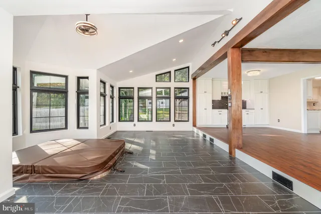 a view of balcony with wooden floor and fence