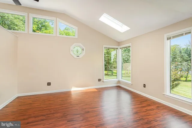 a view of a house with backyard sitting area and garden