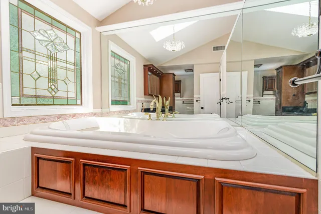 a view of a house with swimming pool and sitting area