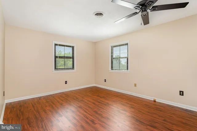 a view of a house with yard and swimming pool