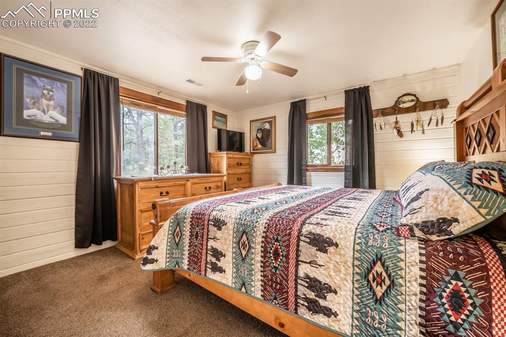 8181 Maple Drive Rye, CO 81069 - Photo 16 of 50 a bed sitting in a bedroom next to a window