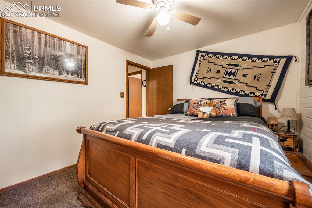8181 Maple Drive Rye, CO 81069 - Photo 19 of 50 a bedroom with a bed and a painting on the wall