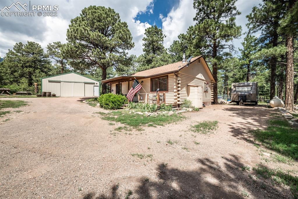 8181 Maple Drive Rye, CO 81069 - Photo 3 of 50 a front view of a house with a yard and garage