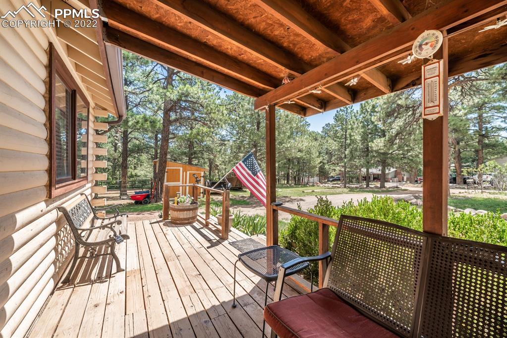 8181 Maple Drive Rye, CO 81069 - Photo 5 of 50 a view of porch with wooden floor and outdoor seating