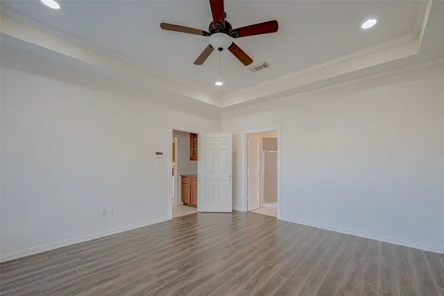 a bathroom with a double vanity sink mirror and bathtub