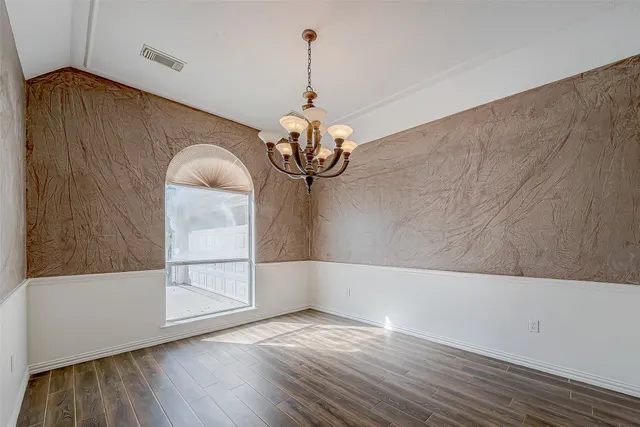 a very nice looking room with wooden floor