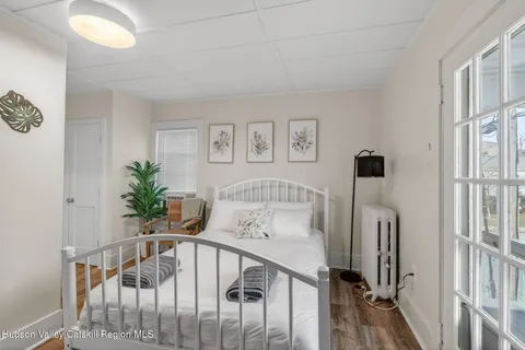 a view of a livingroom with furniture and floor to ceiling window