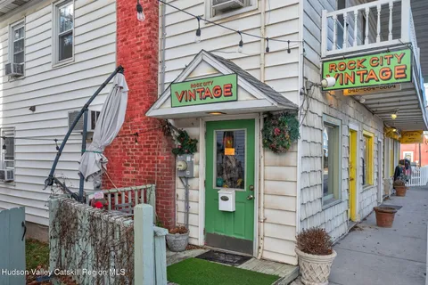 a view of a street with sitting area