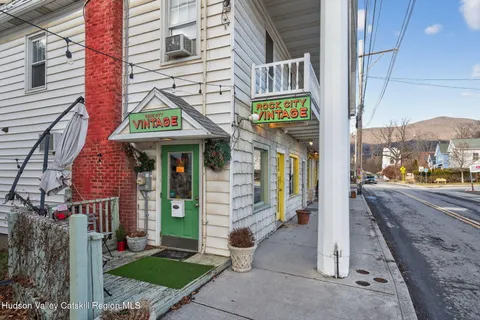 a view of a brick building with a sign on the wall