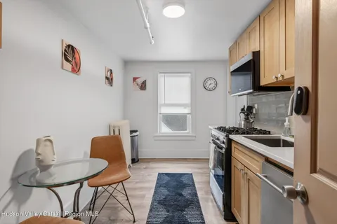 a kitchen with a stove a sink and a microwave