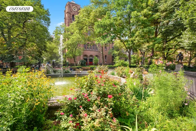 a view of swimming pool with lawn chairs and plants
