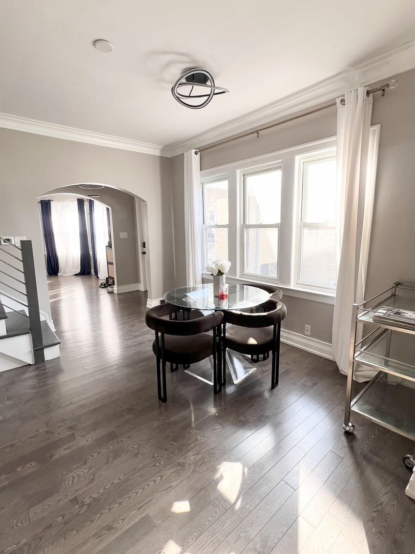 3336 Grand Boulevard Brookfield, IL 60513 - Photo 9 of 35 a living room with furniture a table and large windows