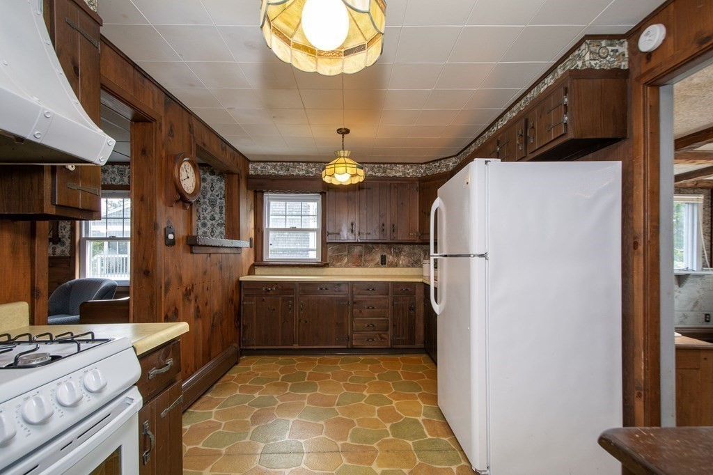 37 Pine Point Road Duxbury, MA 02332 - Photo 8 of 24 a kitchen with refrigerator and window