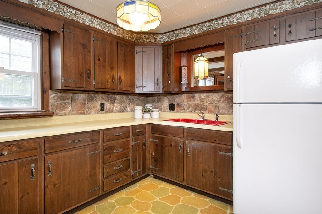 37 Pine Point Road Duxbury, MA 02332 - Photo 9 of 24 a kitchen with cabinets and window