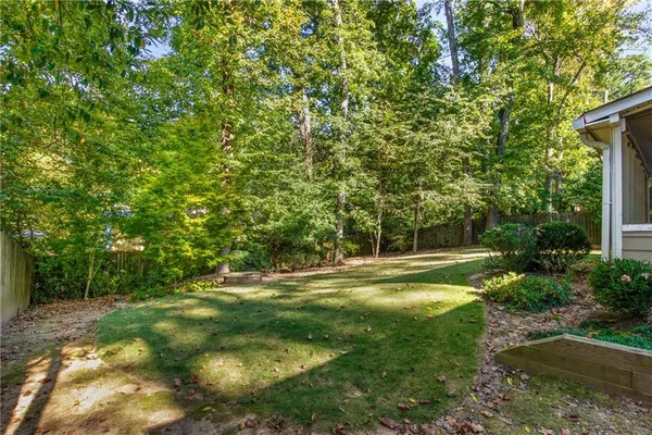 a view of a grassy area with an trees