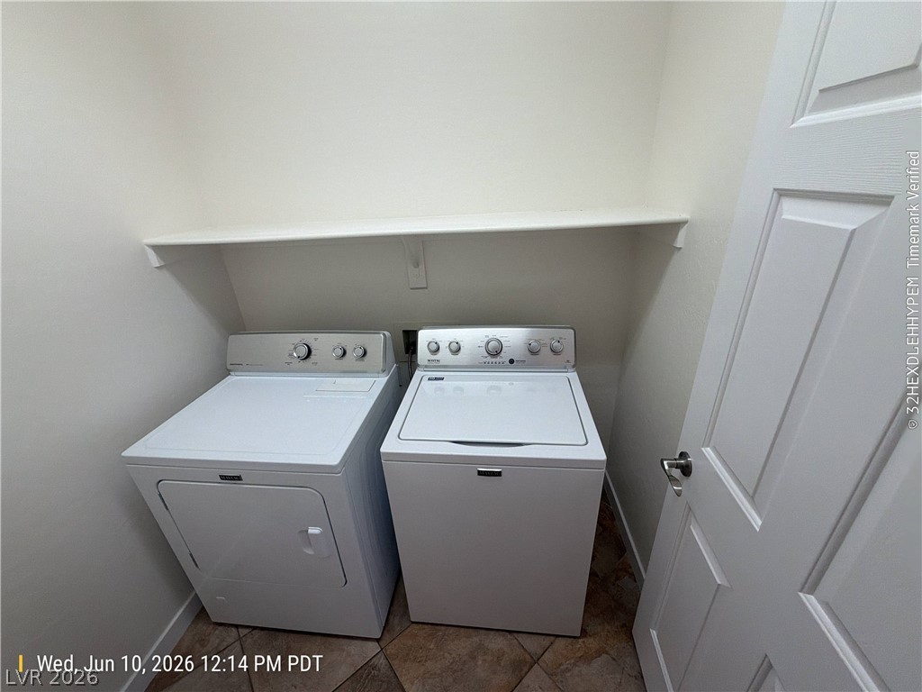 2388 Rue Bienville Way Henderson, NV 89044 - Photo 6 of 16 Functional laundry nook includes appliances and convenient overhead shelving for storage.