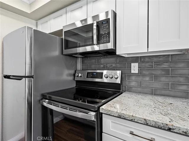 a kitchen with a stove and a microwave