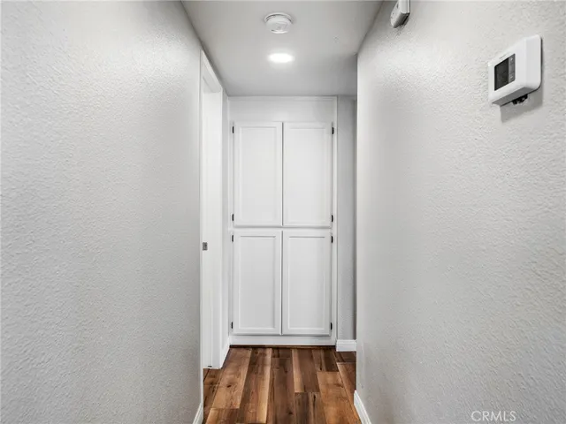 a view of bathroom with a toilet sink and mirror