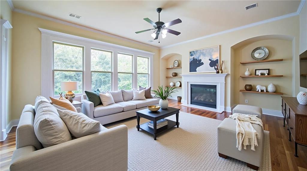 2220 Stirling Bridge Road Cumming, GA 30041 - Photo 16 of 82 a living room with furniture and a fireplace